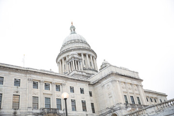 The US Capitol State House is a symbol of American democracy and government power. Its iconic design features a dome, columns, and statues, embodying the values of freedom, liberty, and national unity