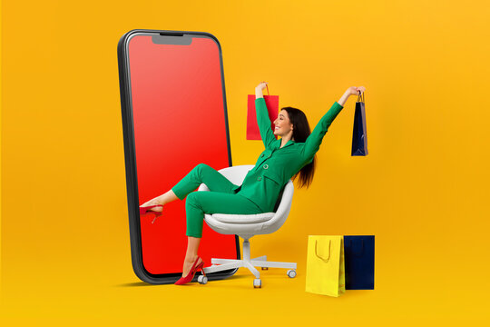 Shopaholic lady enjoying seasonal discounts and sales, holding colorful shopper bags while sitting near huge cellphone - Powered by Adobe