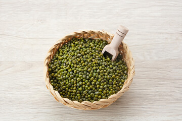 Green mung beans served on wooden bowl. Food ingredient