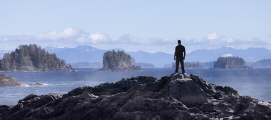 Adventurous Man Standing on the Ocean Coast by the Ocean. 3d Rendering Adventure Composite. Background from British Columbia, Canada.