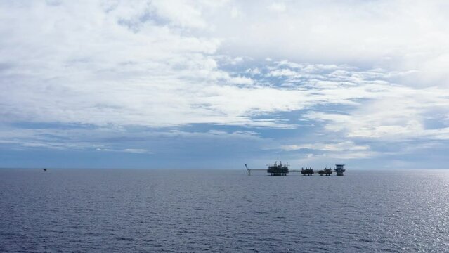 Central processing platform (cpp) in the middle of the ocean on cloudy day - upstream industry
