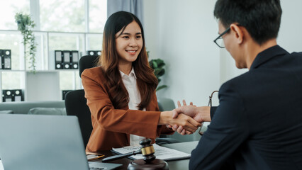Shaking hands, Bribery of female asia japanese chinese lawyer people earn dollars after winning a lawsuit. extorting money from clients in legal cases