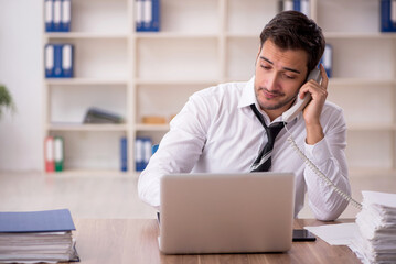 Young male employee working in the office