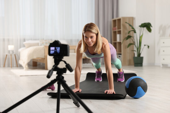Fitness trainer recording online classes at home