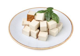 Plate with delicious fried tofu and basil on white background