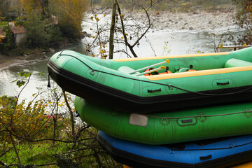 Inflatable rubber fishing boats near beautiful river