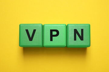 Green cubes with acronym VPN on yellow background, top view