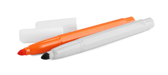 Different stylish colorful markers and caps on white background