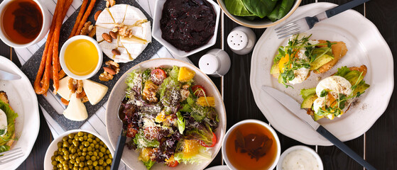 Different tasty food for brunch on dark wooden table, flat lay. Banner design