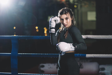 female muay thai boxer punching