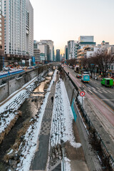 Fototapeta premium Landscape of a small river frozen in winter ice