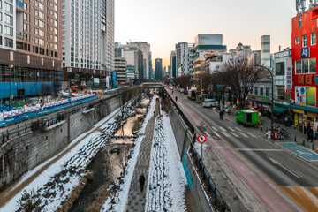 Landscape of a small river frozen in winter ice