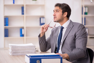 Young male employee working in the office