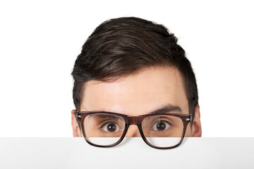 Man in glasses holding blank white paper over his face