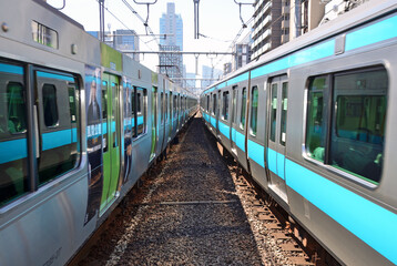 Two Trains running side by side near JR Okachimachi Station in Tokyo