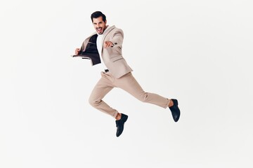 cheerful man businessman smiling happy beige running victory suit business winner