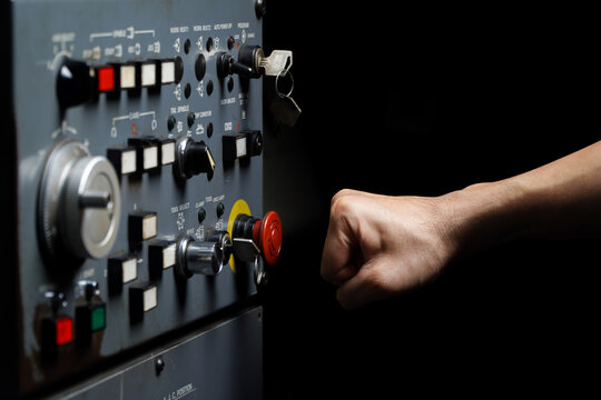 Press the emergency button on cnc machine control panel at factory,concept of prevention before damage of CNC machines