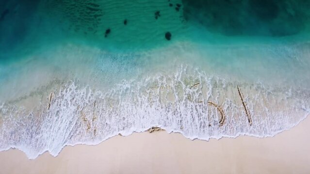 Invest return letter  written on the beach sand and erased with a wave,and reveals  a new letter  concept video 