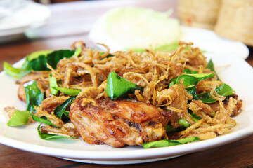 Stir-Fried Chicken with Lemongrass, on a white plate, close up, selective focus