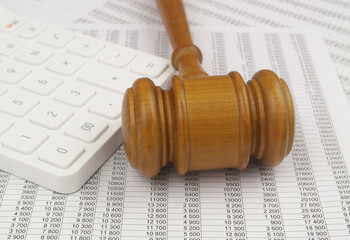 Judge gavel with documents and calculator. Business and laws concept.
