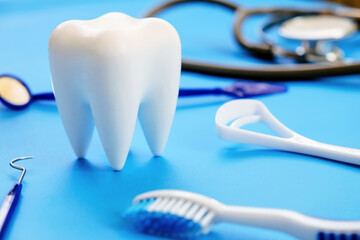 Fototapeta na wymiar Dental model and dental equipment on blue background, concept image of dental background. 