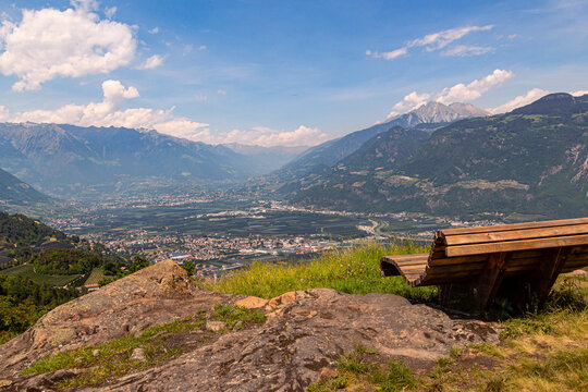 Panoramic view to city Merano and mountain range texelgroup seen from little Church St. Hippolyt
