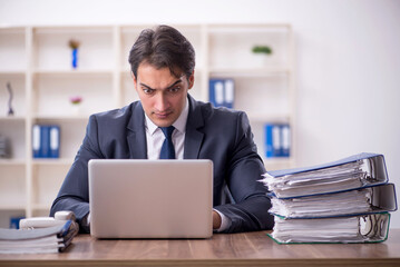 Young male employee working in the office