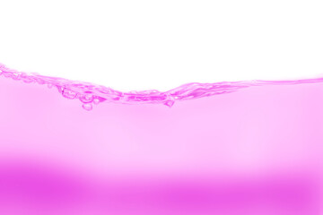 Drink clean pink water in a glass and the bubbles look like splashes and waves.	