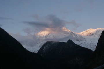 sunrise over snowy mountains