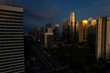 Fototapeta premium aerial shoot of Jakarta skyline during the golden hour. Jakarta is the capital city of indonesia that also one of the most populated city in the world.