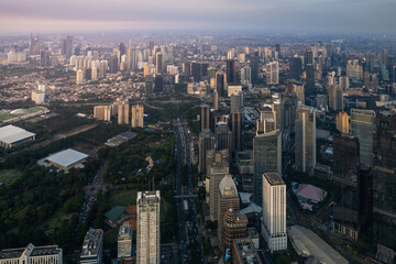 Fototapeta premium aerial shoot of Jakarta skyline during the golden hour. Jakarta is the capital city of indonesia that also one of the most populated city in the world.