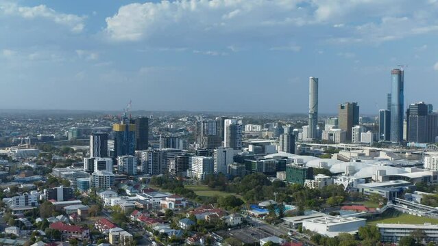Aerial shot flying over West End looking towards Brisbane City and West End's Musgrave Park in shot. Brisbane river in background.