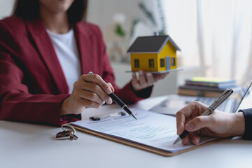 Real estate agent and customer make contract to buy and sell house and land approval of a contract...
