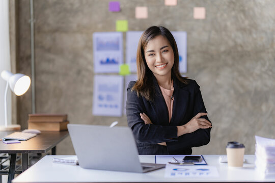 Asian Woman Working Online And Planning Financial Data With Laptop Computer And Financial Documents Work From Home Businesswoman And Financial Planner