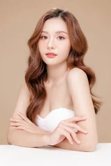 Fotobehang Young Asian beauty woman curly long hair with korean makeup style on face and perfect skin on isolated beige background. Facial treatment, Cosmetology, plastic surgery. © Auttapol