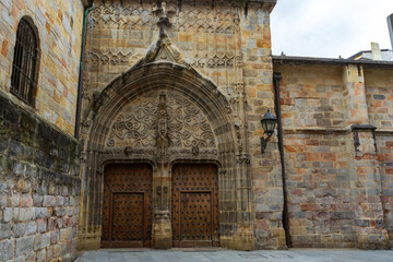 Facade and gates, Old wooden doors Cathedral of Santiago, Bilbao, Spain. Catedral de Santiago de Bilbao.