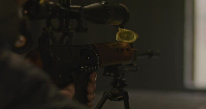 Sniper armed with FN FAL rifle taking aim
