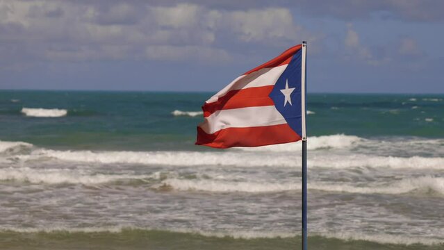 Puerto Rico Flag on Beach travel destination Tax exempt Shelter Economics US Territory, Corporation Taxes