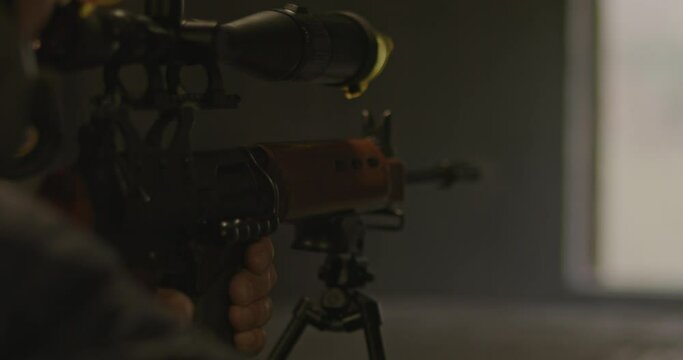 Close up of FN FAL combat rifle ejecting shot casing after firing in slow motion