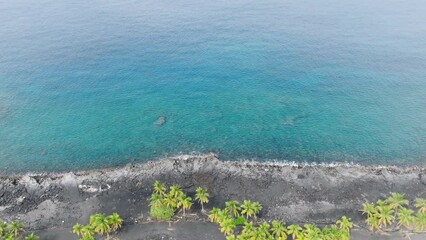 Cinematic hidden Kona Village coast with resort for expensive vacation of wealthy American tourists 4K. Aerial scenic view of favorite vacation spot Kona Village of rich people Big Island Hawaii USA