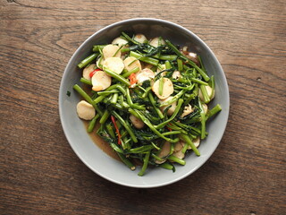 stir fried water spinach with garlic, chili and fish balls
