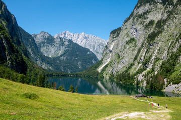 Fototapeta na wymiar Scenic view towards Fischunkelalm and Lake Obersee in Germany's Berchtesgaden National Park with the Watzmann group in the background