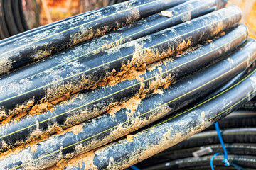 water pipe in the bay on the construction site. Material for plumbing work. Construction work on laying communications.