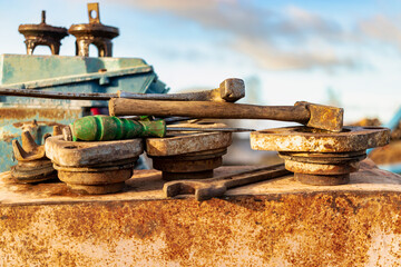 Old working tool at the construction site. Keys, hammer, screwdriver. Hand tool in natural state.