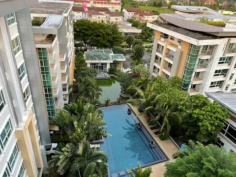 luxury hotel in the city. Royal Place Condominium, view from the top to the swimming pool. Phuket. Tropical island. Thailand. Photo was taken in 2021 year. High-rise residential buildings, aerial view