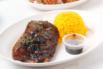 Freshly roasted pork baby back ribs served with fried rice