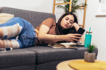 Happy teen girl using smartphone app enjoying online virtual chat video call with friends