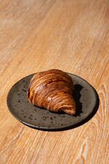 plain croissant butter on wood