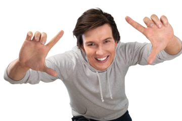 Portrait of smiling young man making frame with hands, isolated