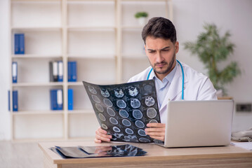 Young male doctor radiologist working in the clinic